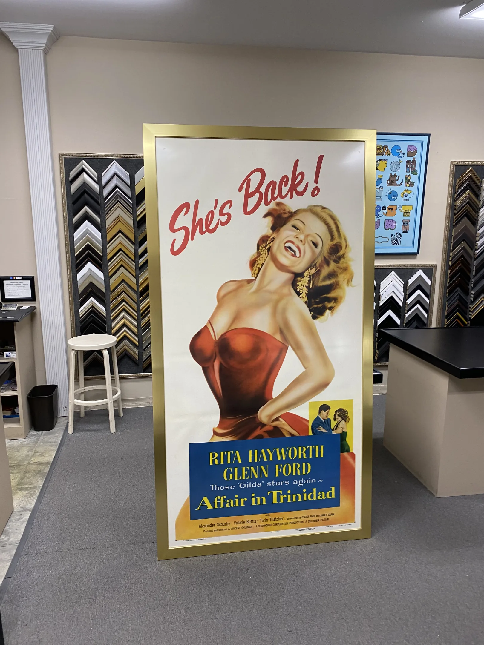 A large poster of a woman in a red dress