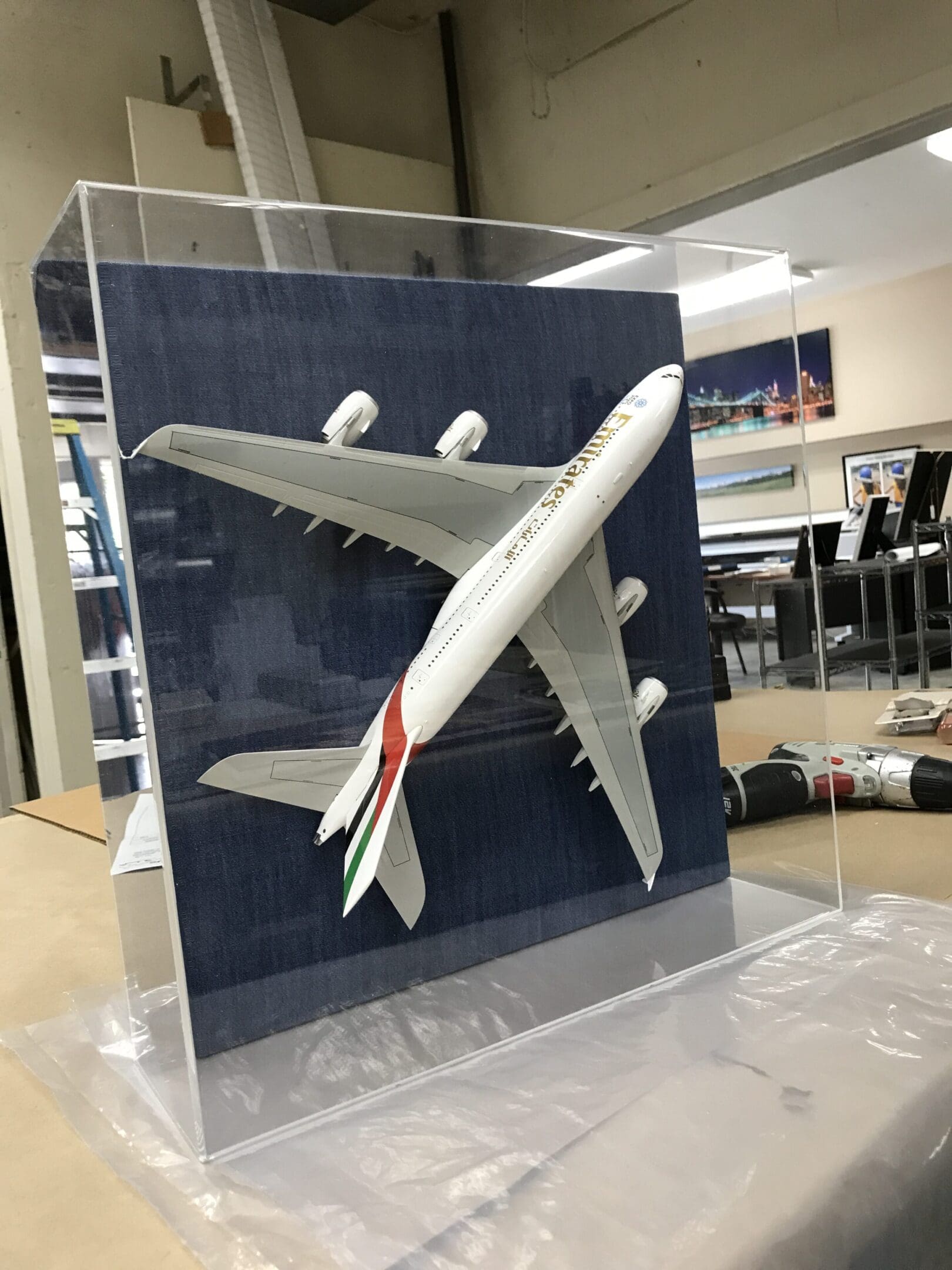 A model airplane is displayed in a case.