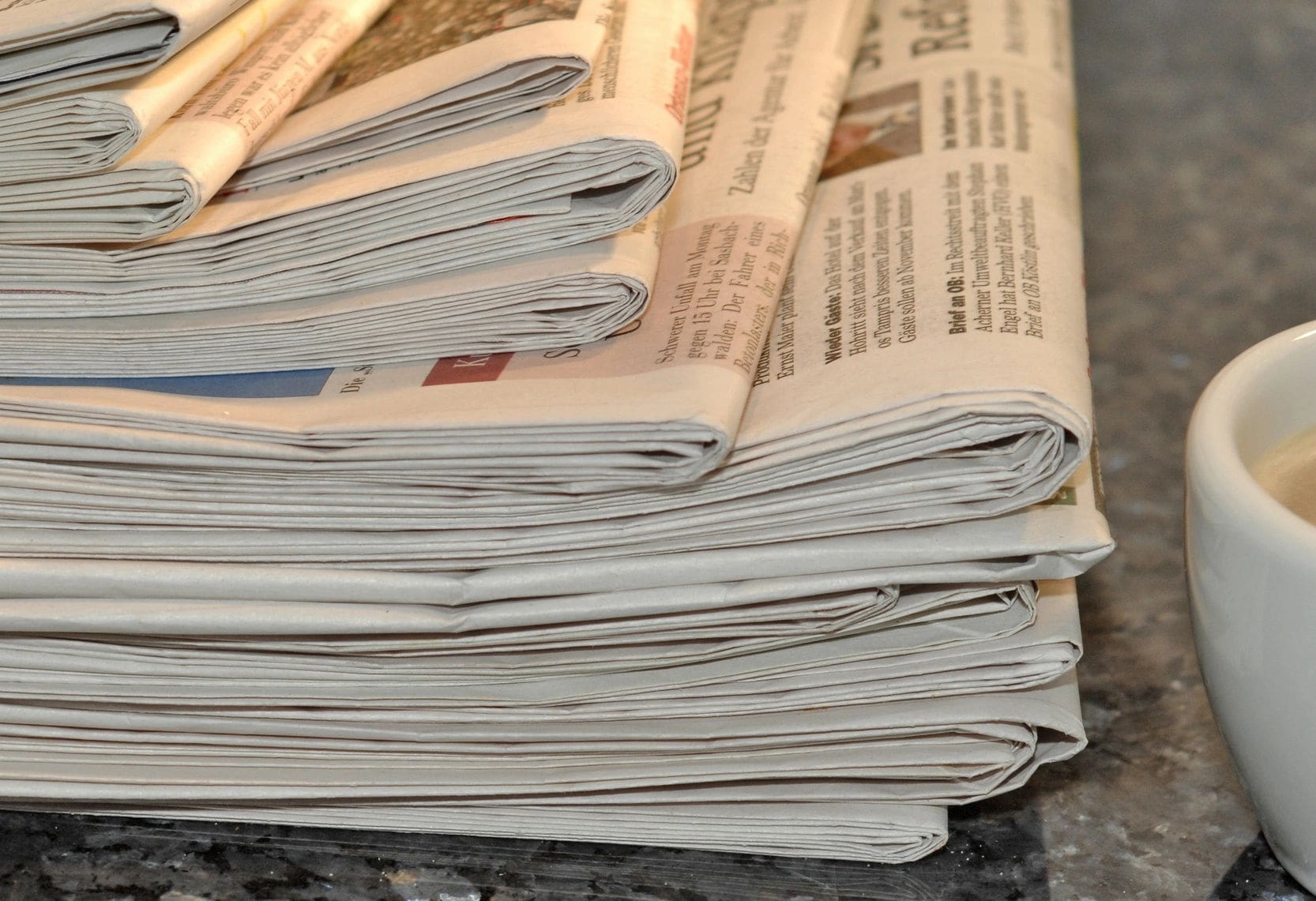 A stack of newspapers on top of each other.