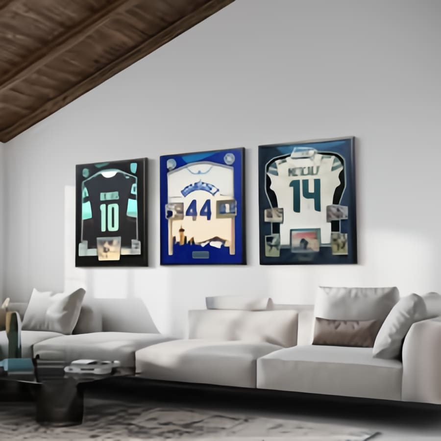 Three framed sports jerseys are hanging on the wall.